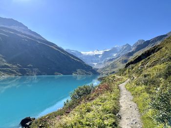 Scenic view of lake and mountains against sky