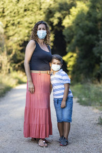 Mother and son with face masks