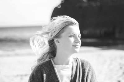 Portrait of smiling young woman outdoors