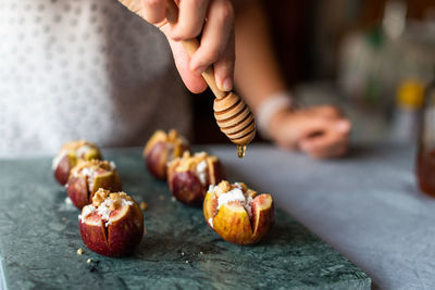 Close-up of man preparing food on table