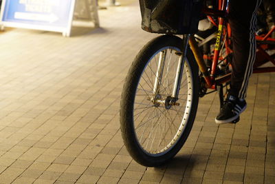 Low section of man riding bicycle