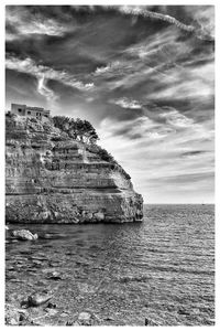 Scenic view of sea against cloudy sky