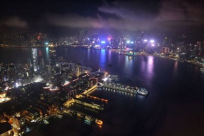 High angle view of illuminated buildings in city at night