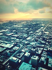 High angle view of buildings against sky during sunset