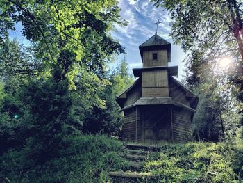 Low angle view of built structure against trees