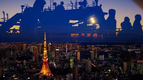 Aerial view of illuminated city at night