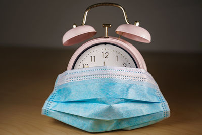 Close-up of clock on table