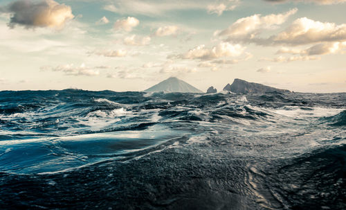 Scenic view of snowcapped mountains against sky during sunset stromboli