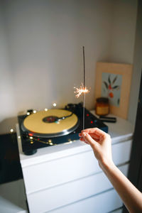 Close-up of hand holding sparklers