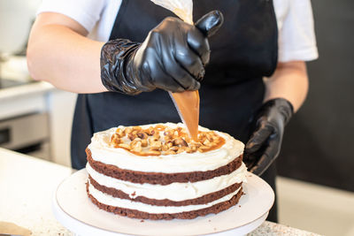 Midsection of man preparing food