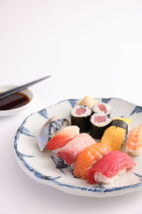 Close-up of dessert in plate on white background