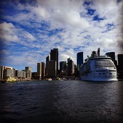 City skyline against cloudy sky