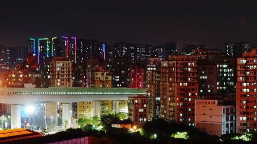 High angle view of illuminated buildings at night