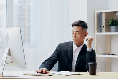 Businesswoman working at desk in office