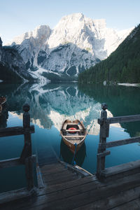 Scenic view of lake by snowcapped mountains during winter