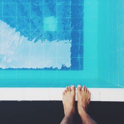 Low section of woman in swimming pool