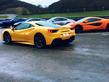 View of yellow car on road