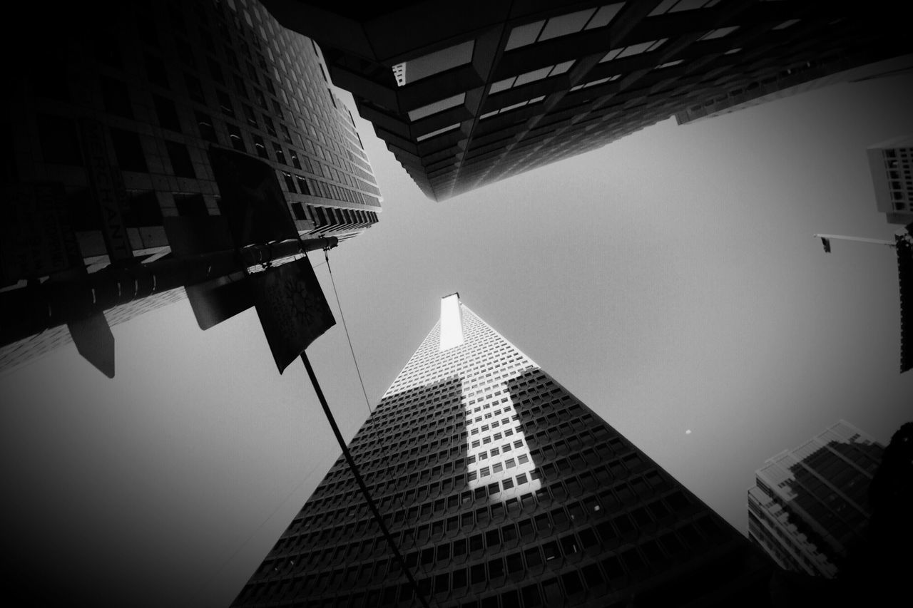 LOW ANGLE VIEW OF MODERN BUILDINGS AGAINST SKY