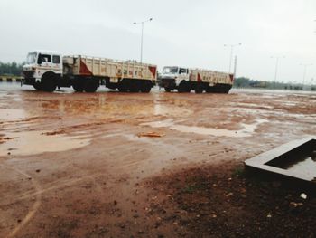 Train on road against sky