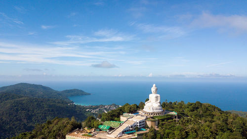 Scenic view of sea and buildings against sky