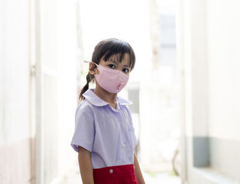 Portrait of girl wearing mask