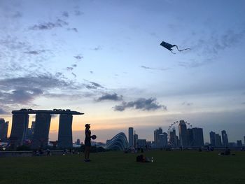 Skyscrapers against cloudy sky