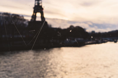 Close-up of water splashing against sky during sunset