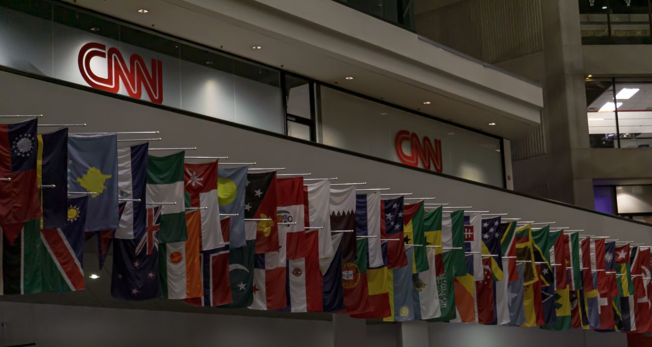 LOW ANGLE VIEW OF VARIOUS FLAGS HANGING ON WALL