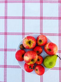 Directly above shot of apples on table against wall