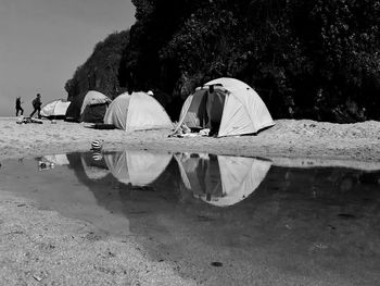 Rear view of people in lake