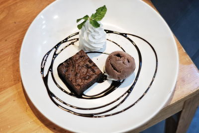 High angle view of chocolate cake in plate on table