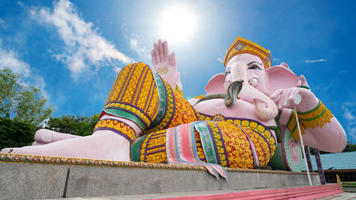 Low angle view of statue against sky