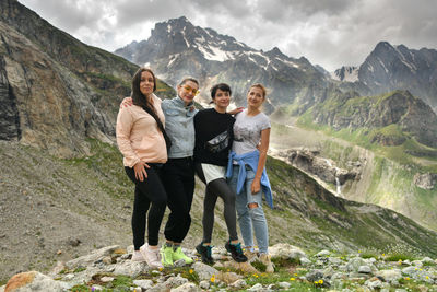 A group of friends climbed high in the mountains