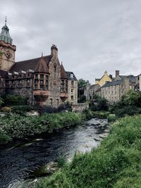 View of river flowing through buildings