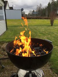 Bonfire on barbecue grill in lawn