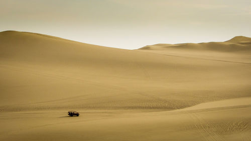 Scenic view of desert against sky