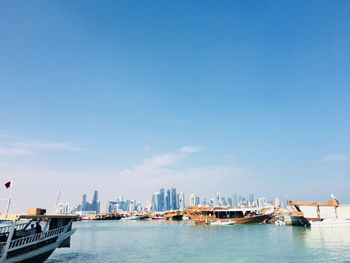 Panoramic view of sea and buildings against sky