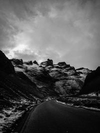 Road amidst landscape against sky