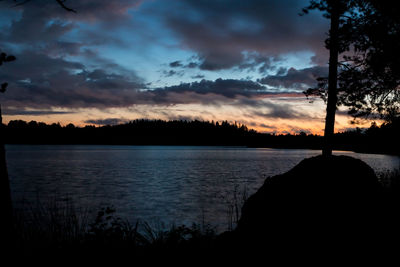 Scenic view of lake against sky during sunset
