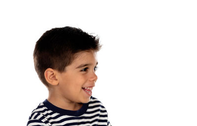 Portrait of happy boy against white background