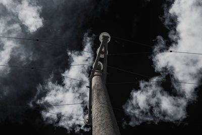 Low angle view of smoke stack against sky