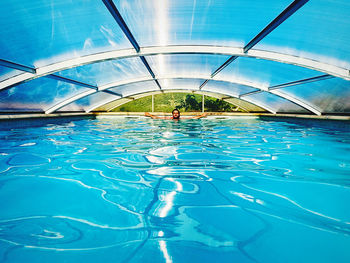 Man swimming in pool