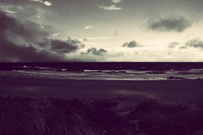 Scenic view of beach against sky