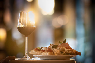 Close-up of wine in glass on table