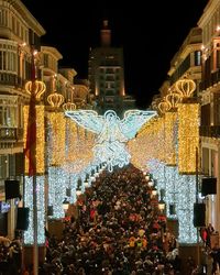 Illuminated lanterns in city at night