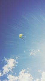 Low angle view of helicopter flying in sky