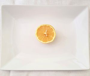 High angle view of lemon slice in plate