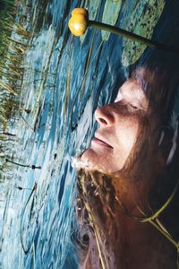Portrait of woman swimming in lake 