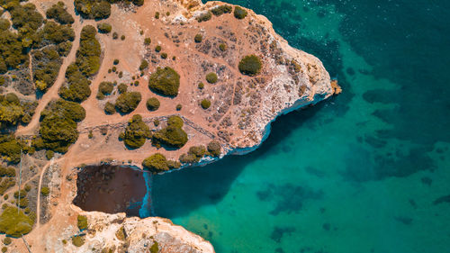 High angle view of rock in sea