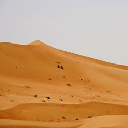 Scenic view of desert against clear sky